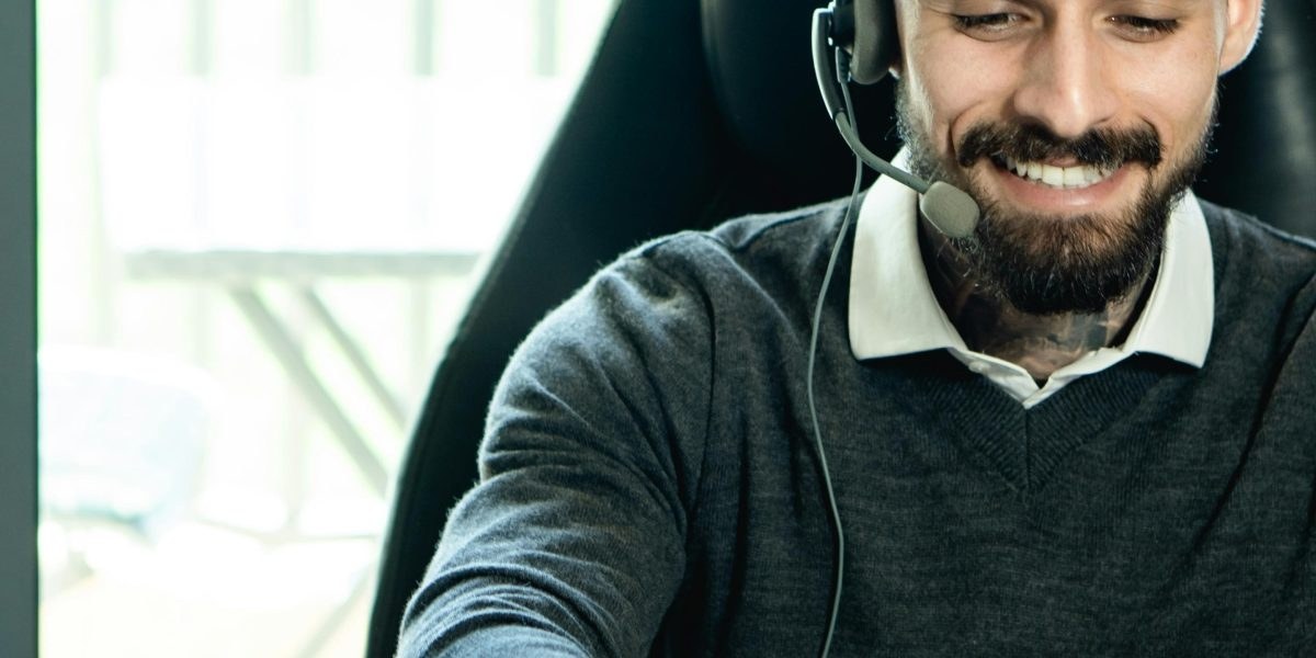 Friendly person offering support over a laptop