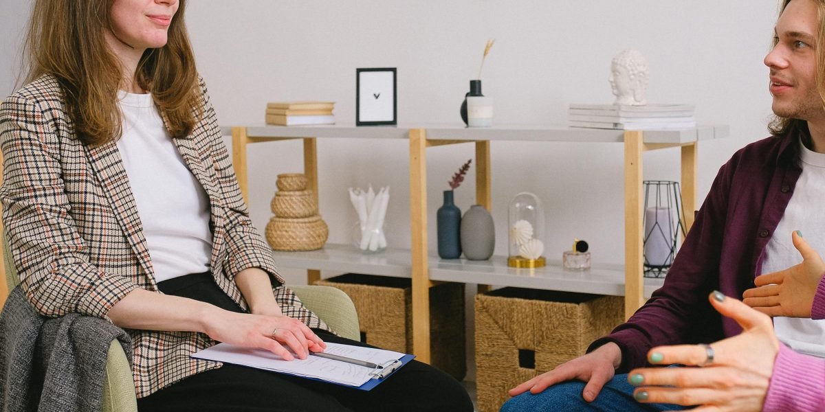 Two people engaged in a discussion, suggesting open communication and resolving relationship issues.