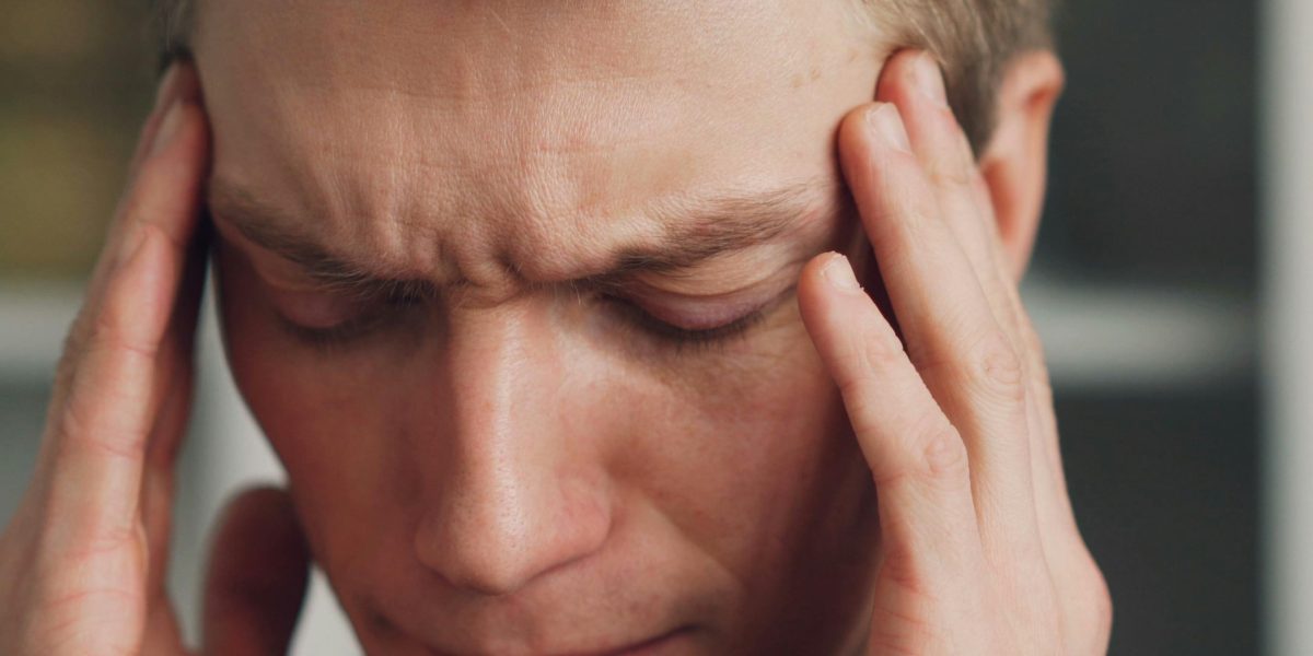 A person looking thoughtful and slightly overwhelmed, reflecting the internal experience of anxiety.