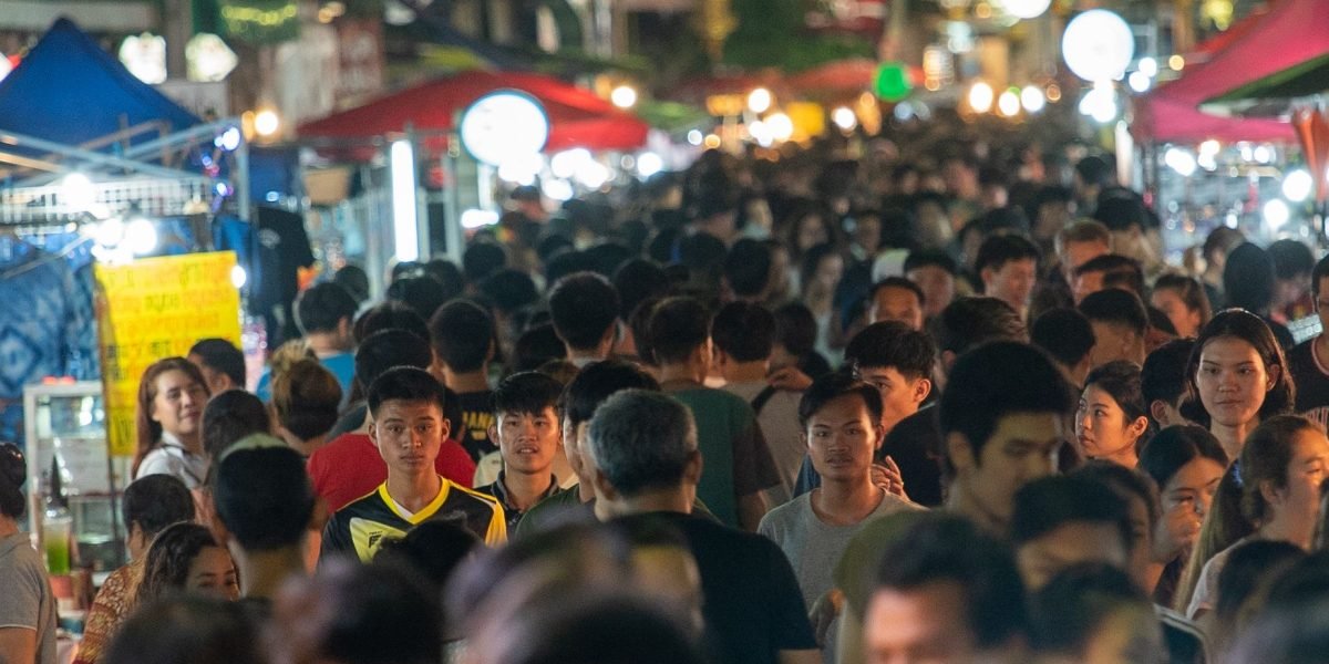 A person looking anxious in a crowded public space, illustrating the fear associated with agoraphobia.