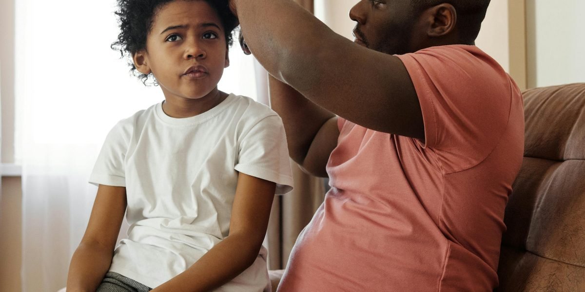 A parent comforting a child who appears scared or anxious, relevant to childhood phobias.