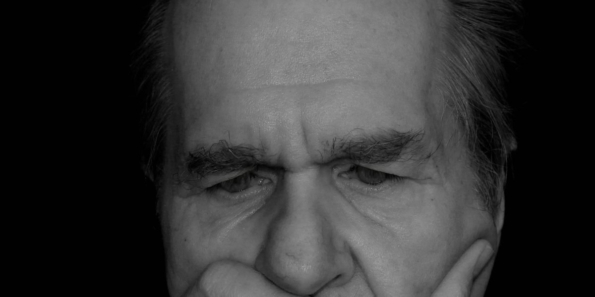 A person reflects deeply, symbolizing the common experience of trying to understand complex mental health concepts.