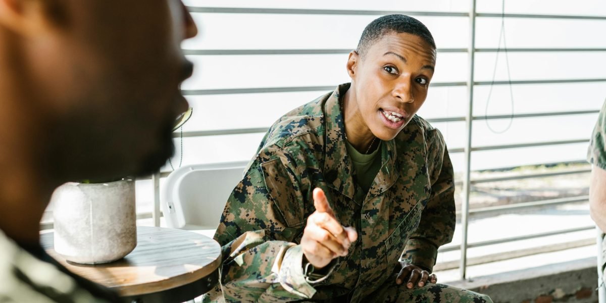 Individuals sharing experiences and finding common ground in a supportive group setting.
