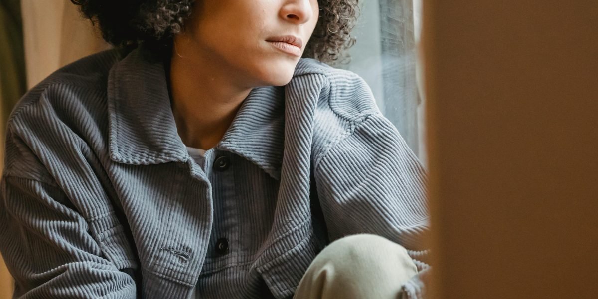 A person experiencing deep-seated distrust, often leading to feelings of isolation and hypervigilance.