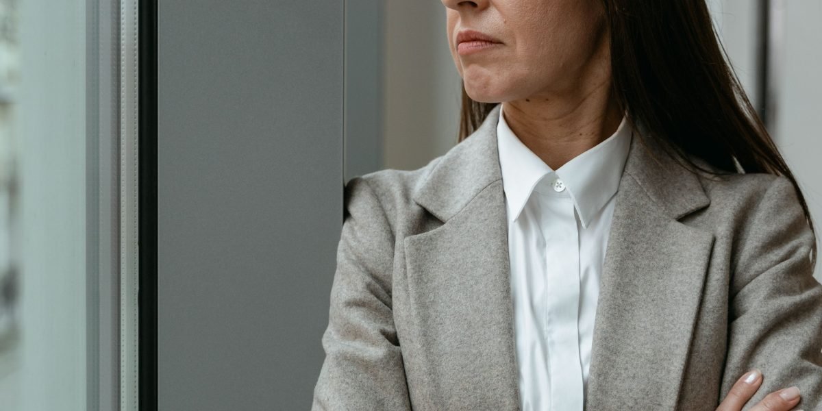 A person reflecting on their career choices with uncertainty or doubt.