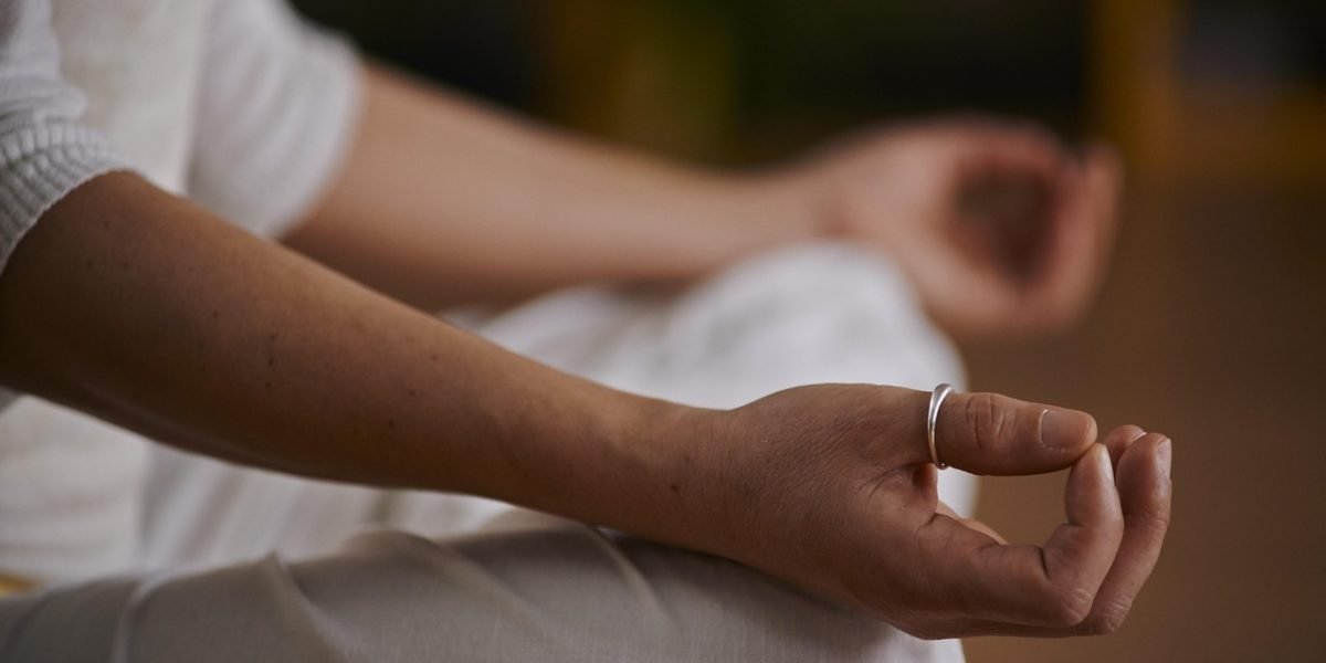 A person calmly practicing mindfulness or deep breathing to manage anxiety.