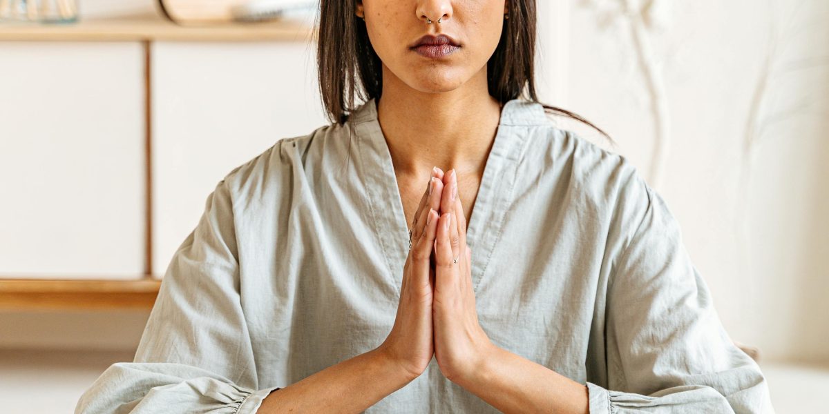 A person in a calm, focused pose, representing the practice of mindfulness and the reduction of anxiety through behavioral therapy.