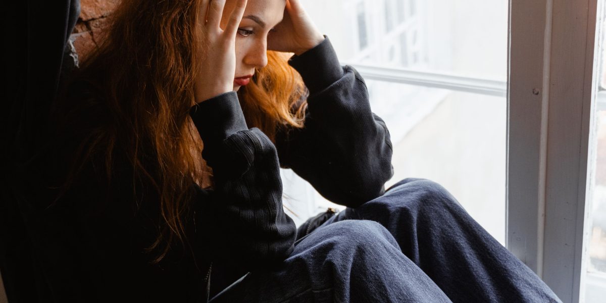 A person experiencing feelings of worry or anxiety, seeking calm.