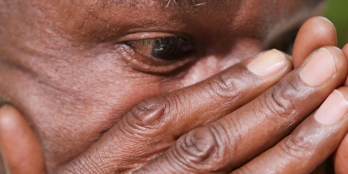 A person sitting alone, head in hands, appearing stressed or overwhelmed, reflecting the internal struggle of a 'mental breakdown'.