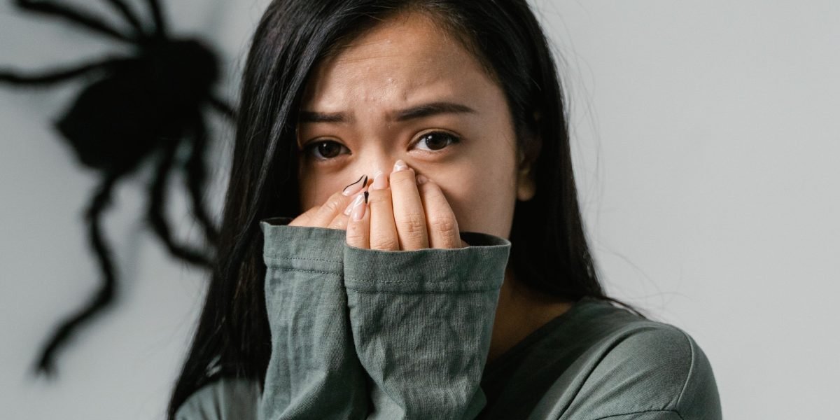 A person showing signs of nervousness or anticipation before an important event, illustrating the natural human experience of anxiety.