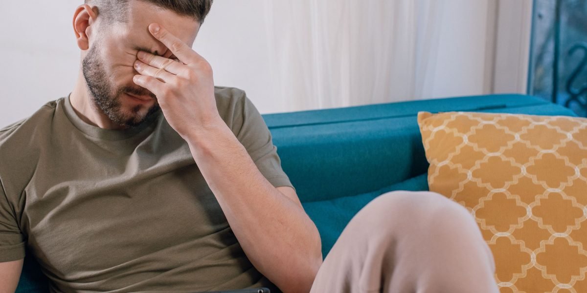 A person experiencing feelings of overwhelming stress or anxiety, reflecting the common struggle.