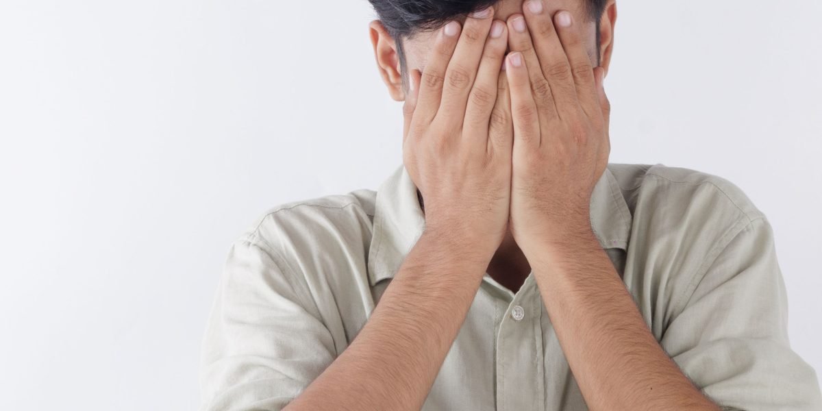 A person experiencing an intense moment of fear or discomfort, reflecting the physical sensations of a panic attack.