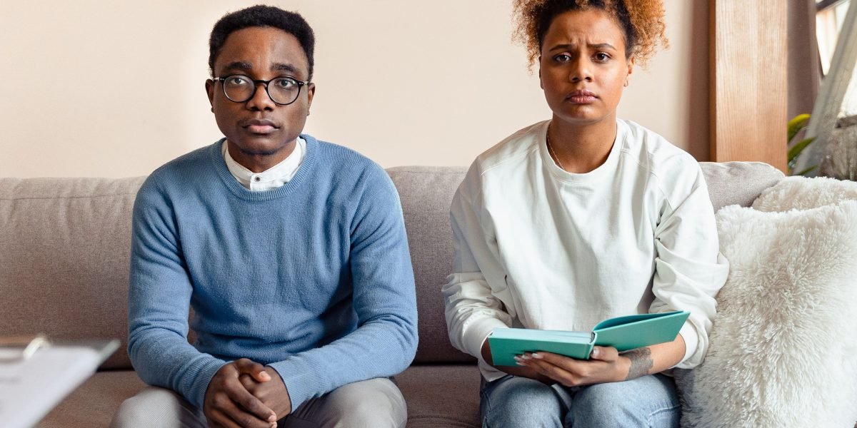 Parents discussing concerns about a student's mental health at home.