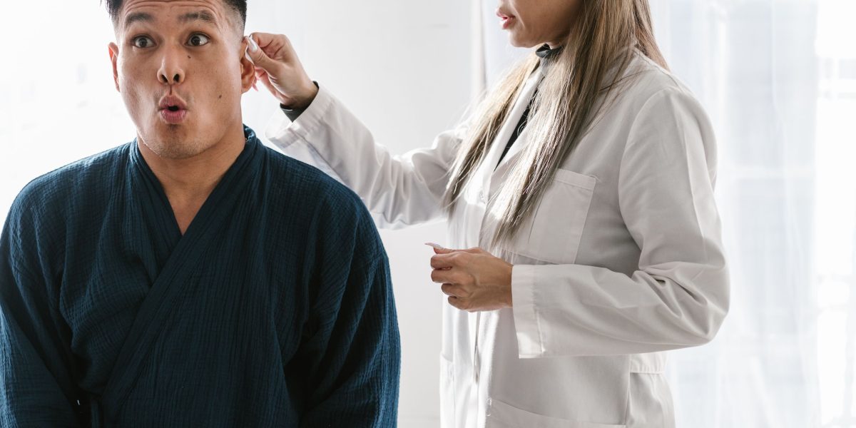 A person speaking with a healthcare professional, possibly a doctor or therapist, conveying concern or seeking guidance about symptoms.