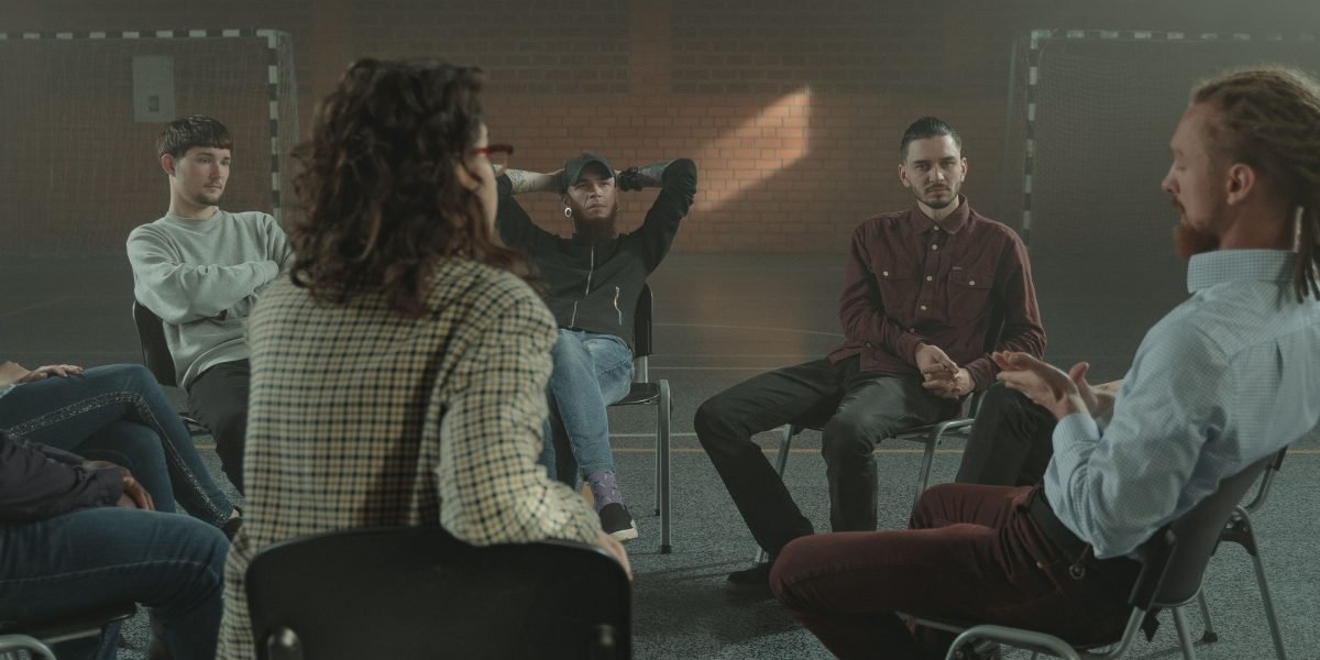 People participating in a support group, finding comfort and understanding in shared experiences.