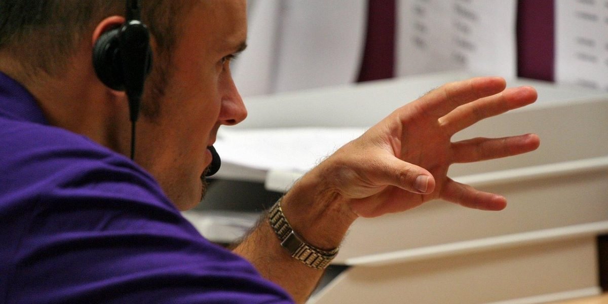 A supportive professional converses with an individual, illustrating the diagnostic process in a therapy setting.