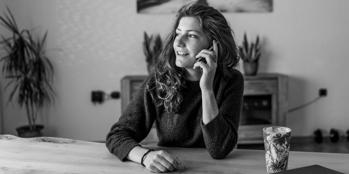 An individual engaging in a supportive conversation with a mental health professional, beginning their healing journey.