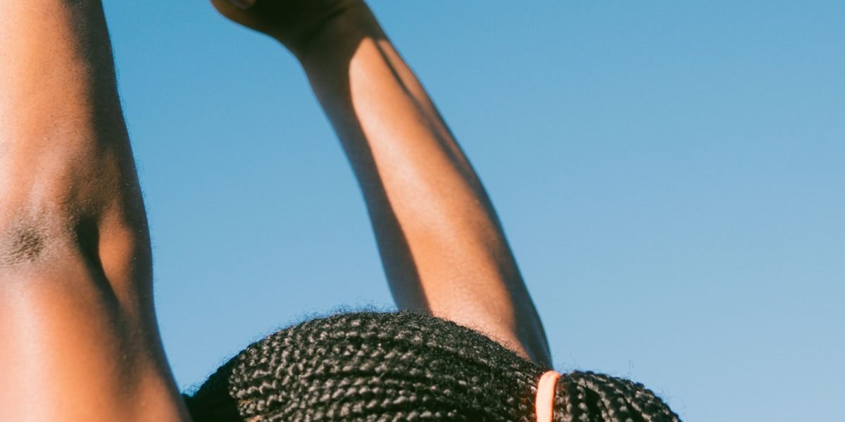 A person enjoying a morning stretching routine, representing the foundation of a calmer mind.